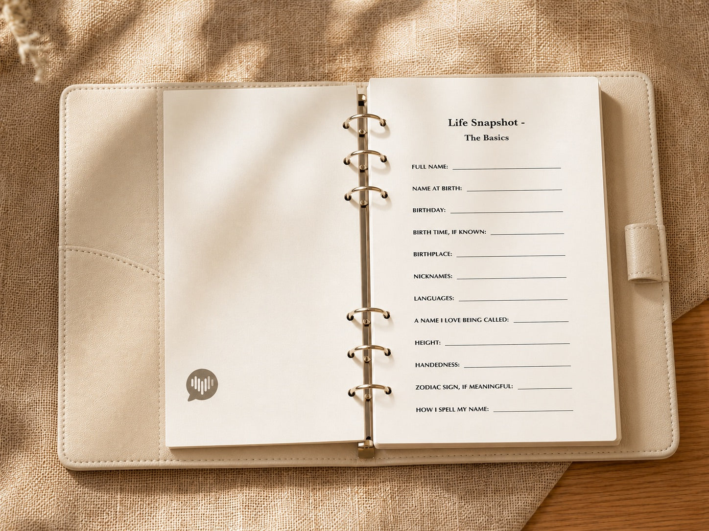 The CoHear journal opened to a Life Snapshot page with fill-in lines for personal basics