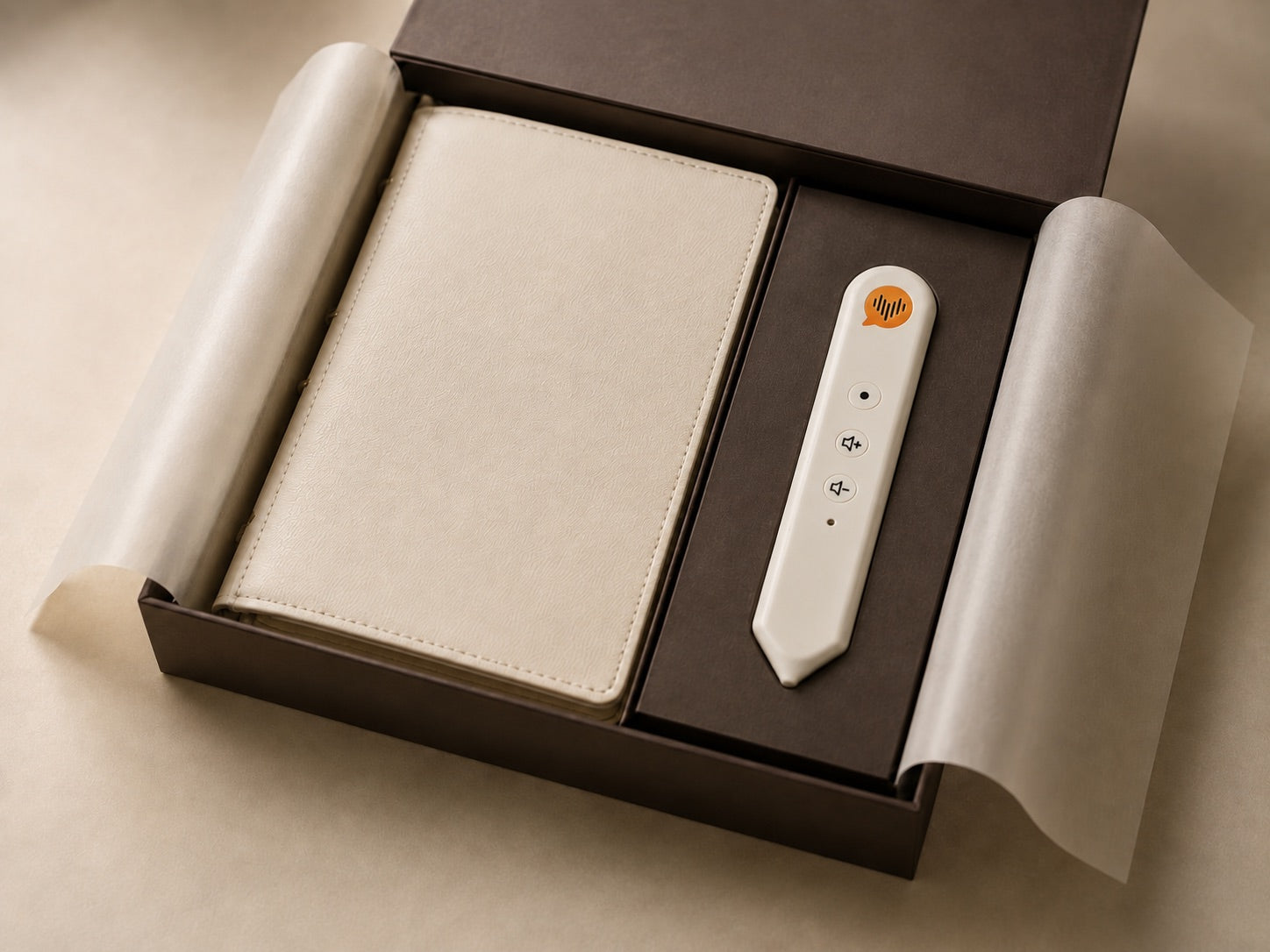 The CoHear journal and voice recorder resting in a deep brown gift box with ivory tissue paper